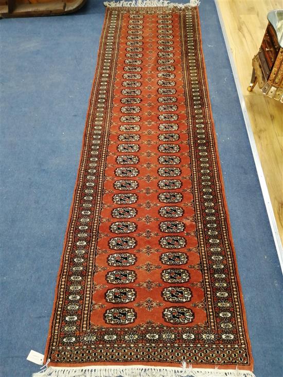 A Bokhara style red ground runner 270 x 80cm